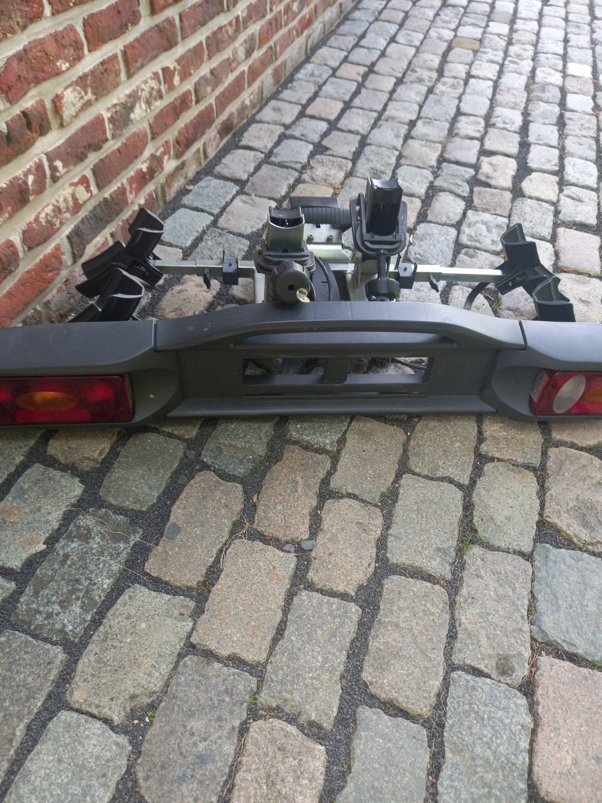 Kantelbare fietsdrager., Ophalen