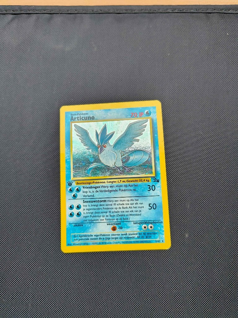 Pokemon Articuno 1st edition fossil Nederlands, Ophalen of Verzenden, Gebruikt, Losse kaart, Foil