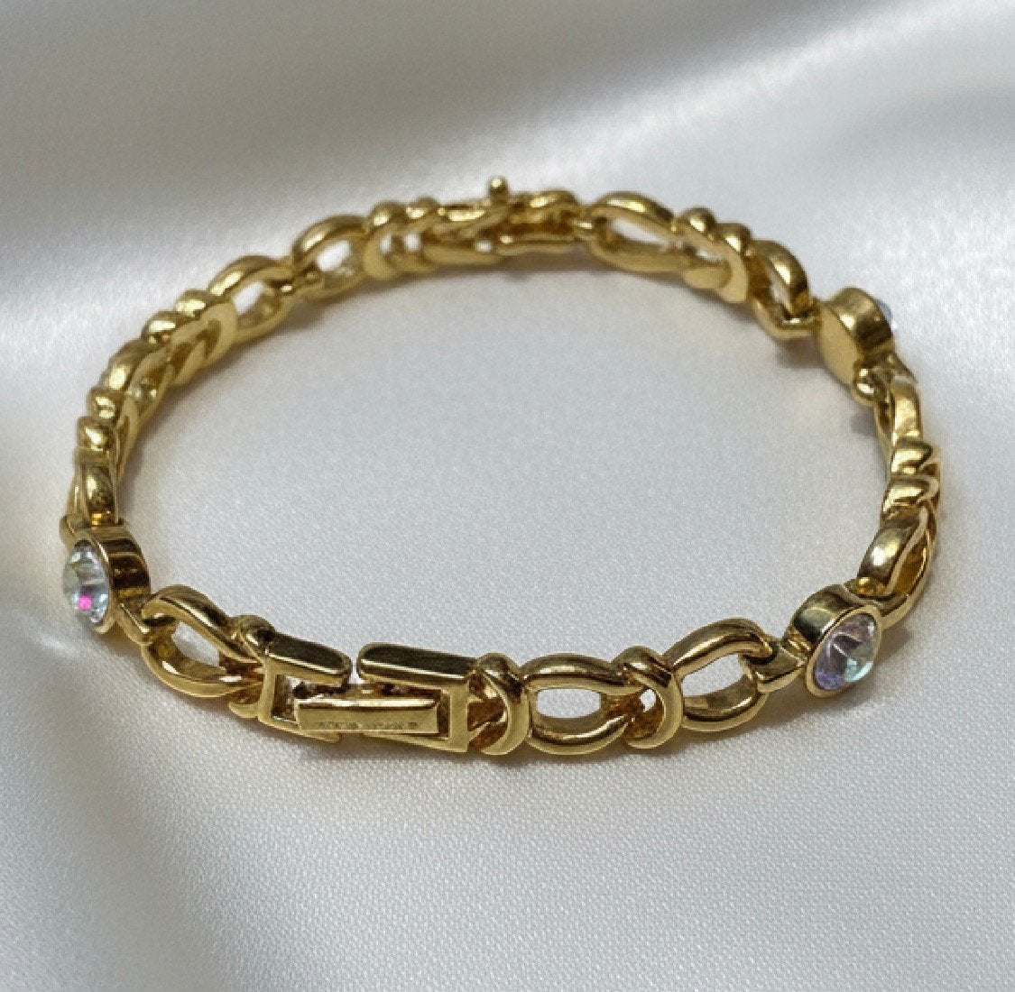 Uitzonderlijke vintage vergulde armband van Nina Ricci, Ophalen of Verzenden, Zo goed als nieuw, Geel, Goud