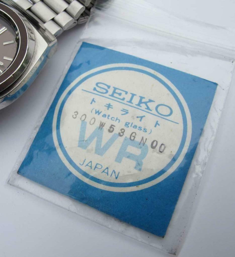 NOS Seiko 300W53GN00 verre cristal pour Seiko 7019-7, Enlèvement ou Envoi, Neuf