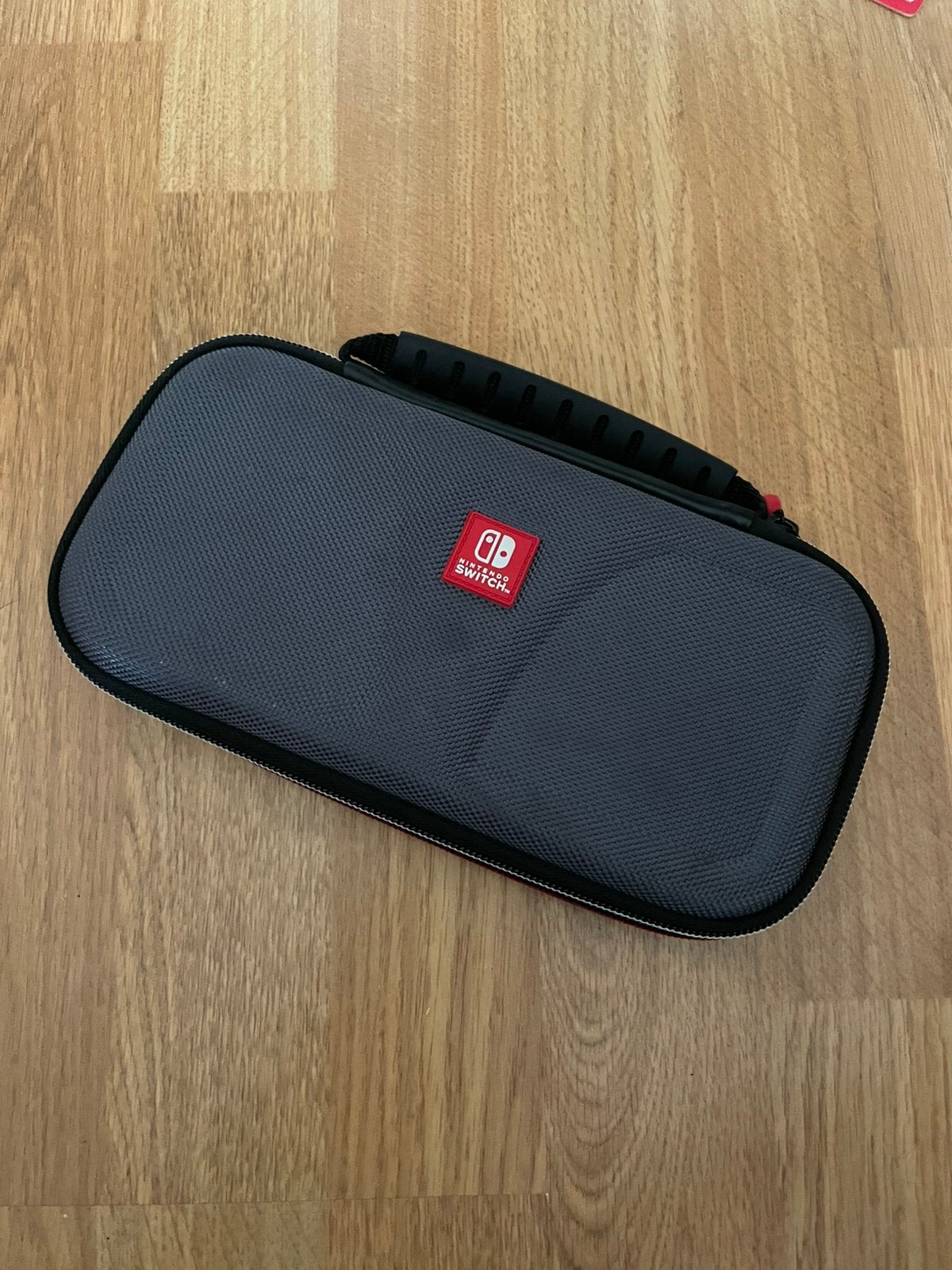 Pochette nintendo switch lite officiel, Enlèvement, Comme neuf