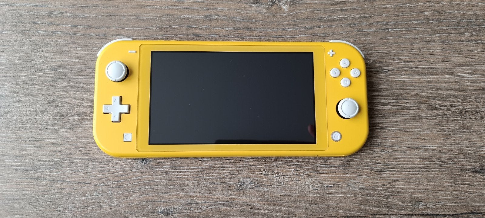 Nintendo Switch Lite Yellow + games + beschermhoes, Ophalen, Geel, Zo goed als nieuw, Met beschermhoes of tas