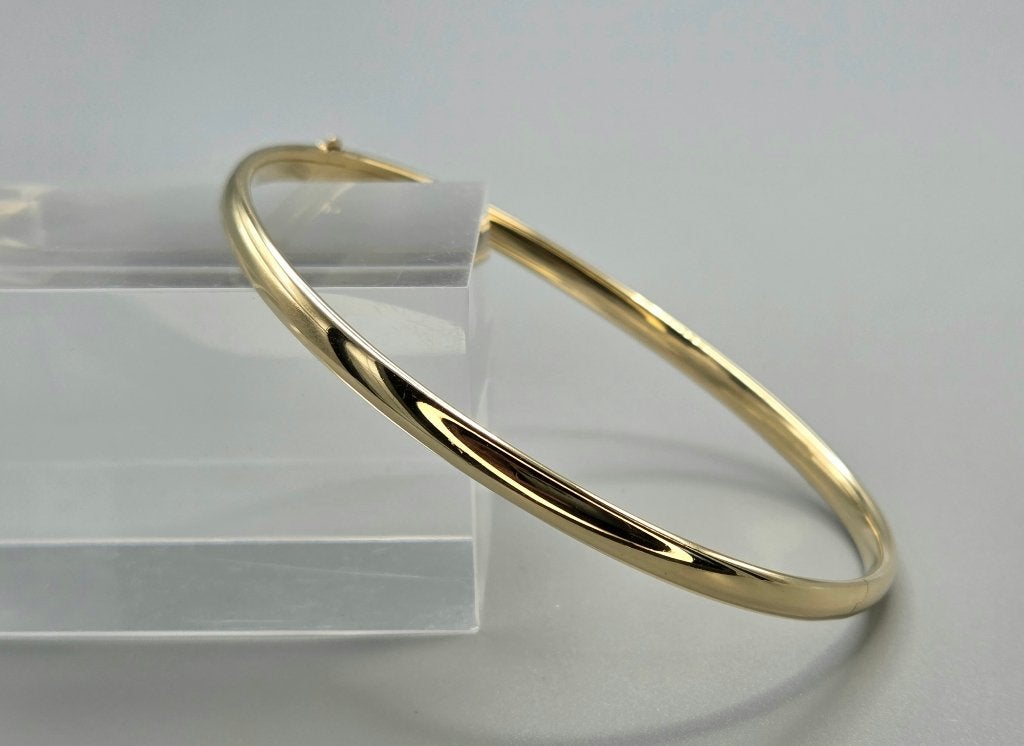Gouden vintage bangle/slavenarmband met brug. 2026/699, Handtassen en Accessoires, Ophalen of Verzenden, Zo goed als nieuw, Goud