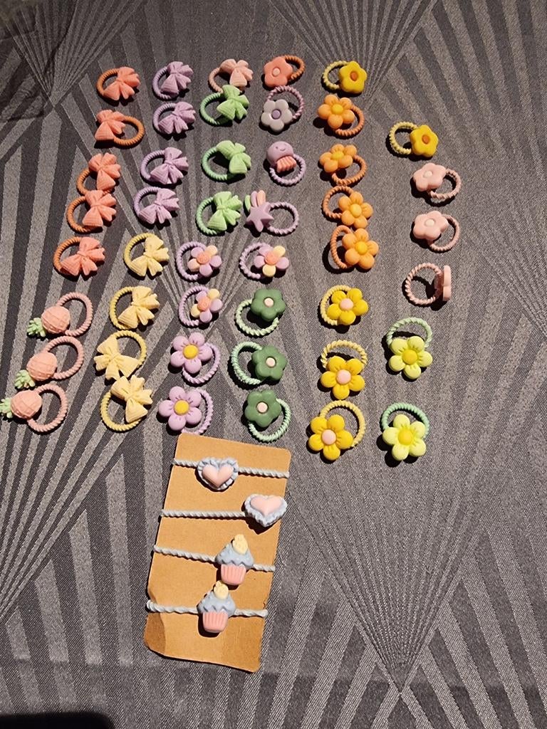 50 splinternieuwe elastische haarbandjes verschillende motie, Ophalen of Verzenden, Nieuw, Verschillende