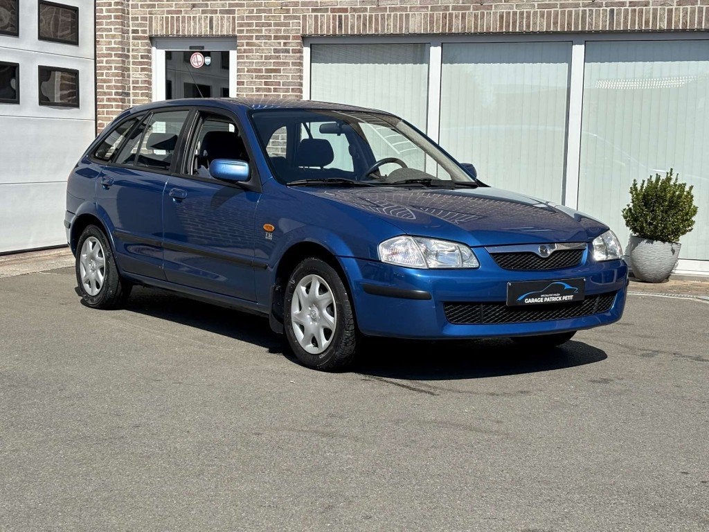 Mazda 323F 1.5i 16v TSi / 86000km / 12m waarborg, Auto's, Voorwielaandrijving, Dealer onderhouden, Stof, 4 cilinders