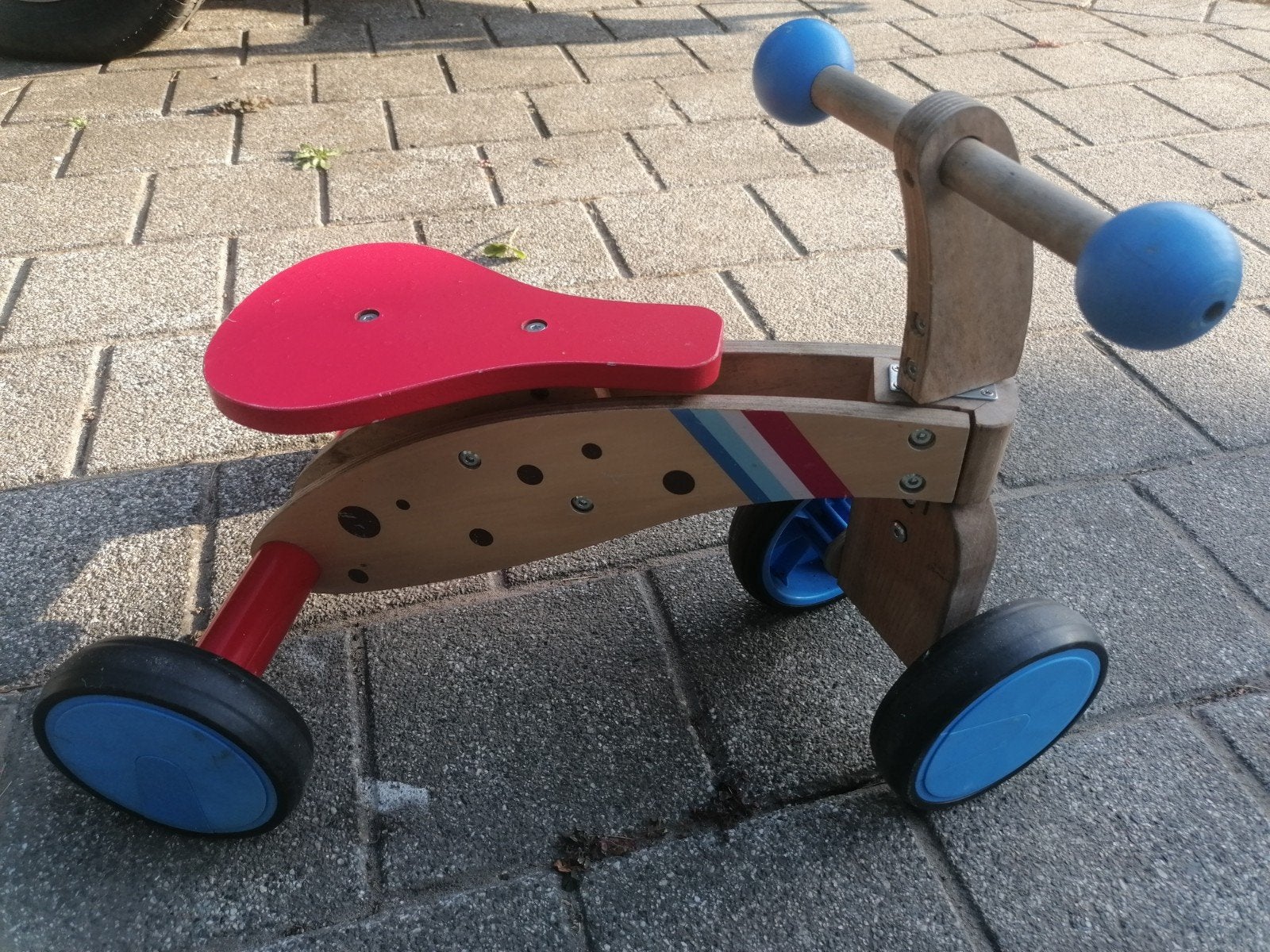 Houten driewieler loopfiets, Ophalen