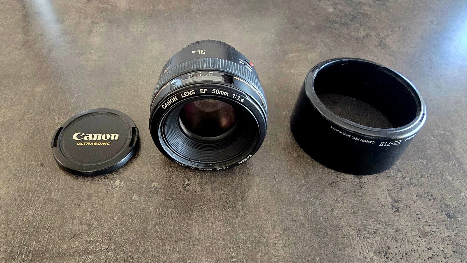 Canon 50 mm EF 1.4 + doppen en zonnekap, Ophalen