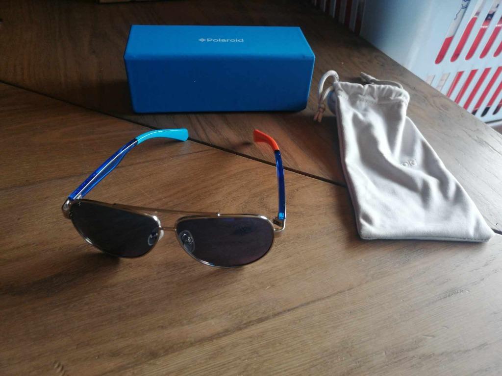 Zonnebril heren merk polaroid met grijze etui en blauw doo, Handtassen en Accessoires, Overige merken, Gebruikt, Zonnebril, Blauw