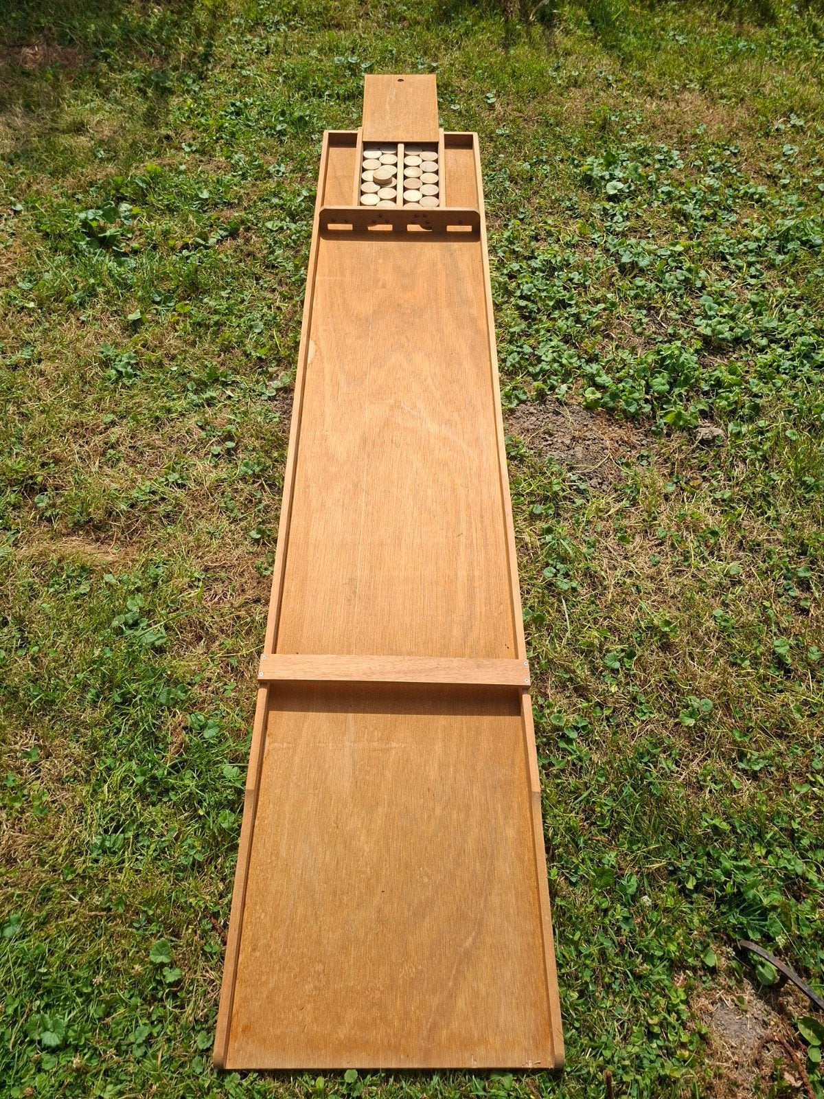 Sjoelbak, Ophalen