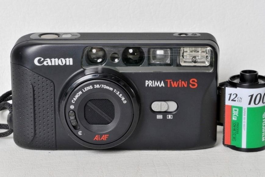Canon Prima Twin S + 35 /70 mm f 3,5-6 + étui et sangle., Audio, Tv en Foto, Fotocamera's Analoog, Ophalen of Verzenden, Zo goed als nieuw