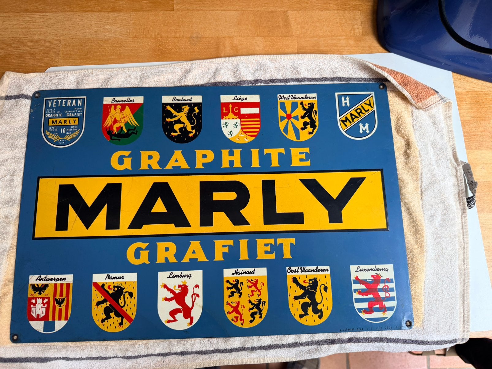 Il s'agit d'upanneau d'affichage vintagedmarque belge Marly, Collections, Enlèvement ou Envoi, Comme neuf, Panneau publicitaire