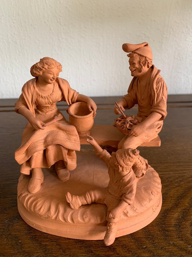 Terracotta beeldje Grasso, Ophalen