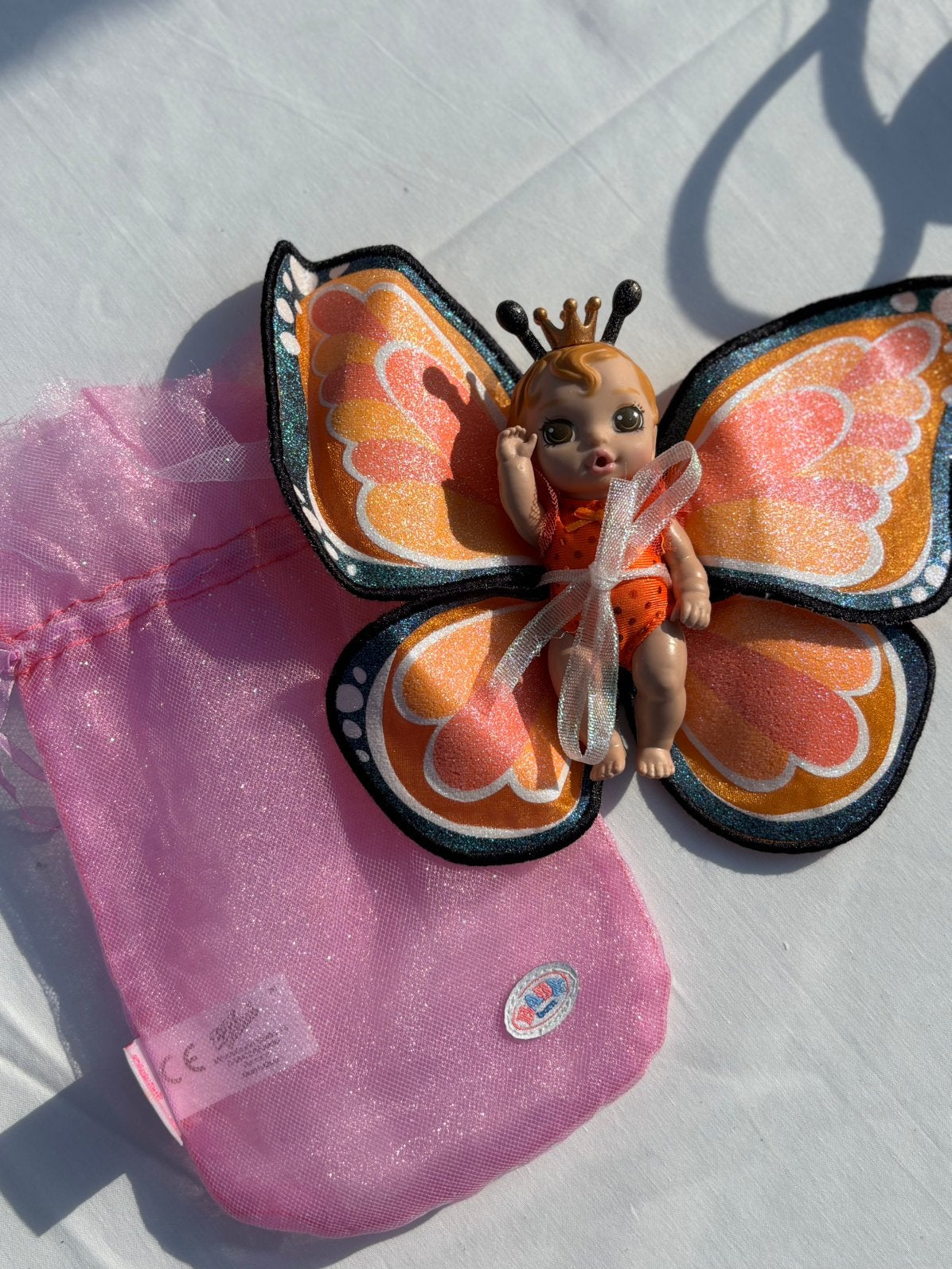 Oranje glitter vlinder babyborn mini, Kinderen en Baby's, Ophalen of Verzenden, Zo goed als nieuw