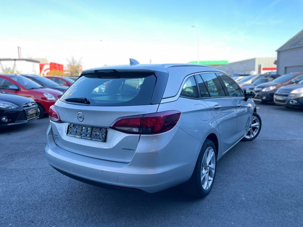 Opel Astra 1.4 benzine | Airco | Gps | Cruise | GARANTIE |, Auto's, Stof, Bedrijf, 5 deurs, 117 g/km