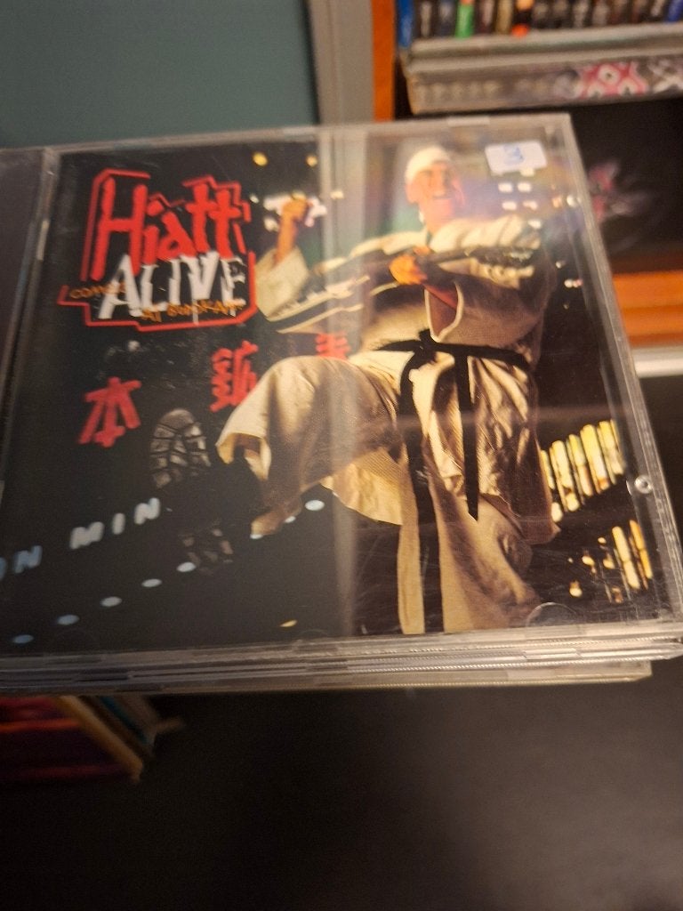 cd-john hiatt & the guilty dogs-hiatt comes alive at budokan, CD & DVD, Comprend un boîtier, Enlèvement ou Envoi, Comme neuf, Rock classique