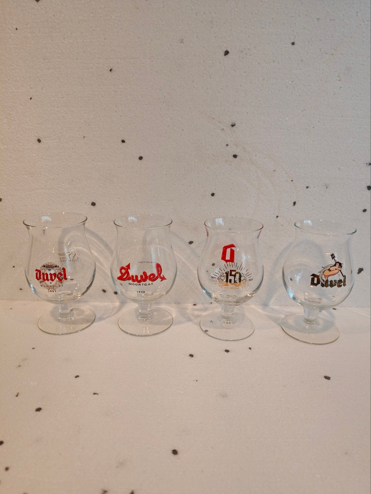 4 Duvel design glazen - diverse jaartallen, Verzenden, Nieuw, Glas of Glazen, Duvel