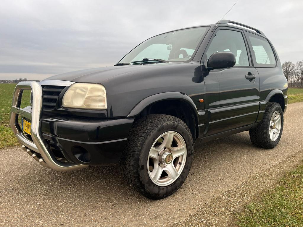 Te koop zeer mooie Suzuki Grand Vitara 1.6 Metal Top 4x4, Autos, Suzuki, Argent ou Gris, Achat, Entreprise, Quatre roues motrices / 4X4