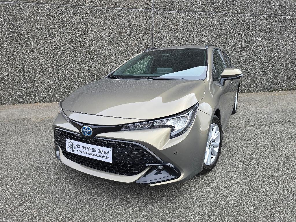 Toyota Corolla TS Hybrid 1.8 Style e-CVT Style AIRCO/GPS/PDC, Stof, 4 cilinders, Corolla, https://public.car-pass.be/vhr/792697df-c4b6-4bc2-9c6d-b42983999115