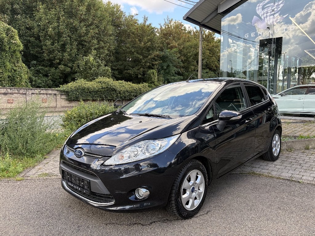 Ford Fiesta 1.6 TDCi Titanium ECOnetic * 12 MAANDEN GARANTIE, Auto's, Voorwielaandrijving, Stof, Zwart, 4 cilinders