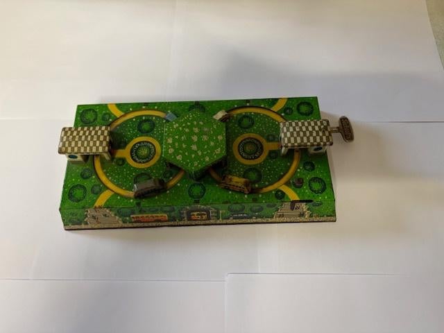 Vintage blikken speelgoed buscarrousel, Ophalen