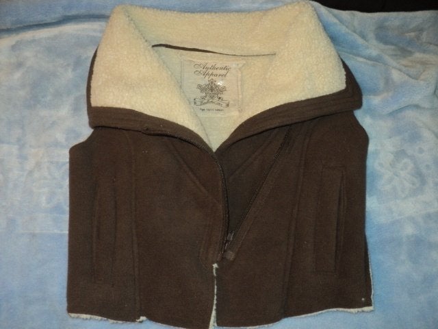 une belle veste sans manches bien chaude taille 11 ans, Kinderen en Baby's, Kinderkleding | Maat 146, Ophalen of Verzenden
