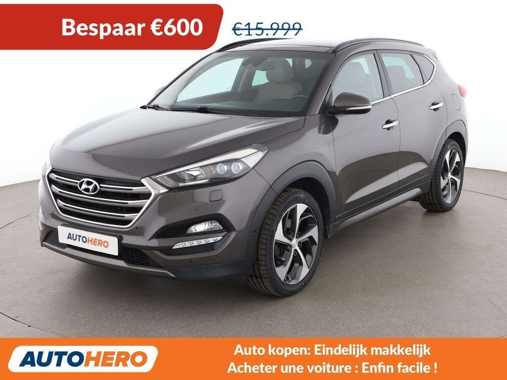 Hyundai Tucson 1.6 TGDI Advantage 4WD (bj 2016, automaat), Auto's, Automaat, Gebruikt, Bruin, Leder