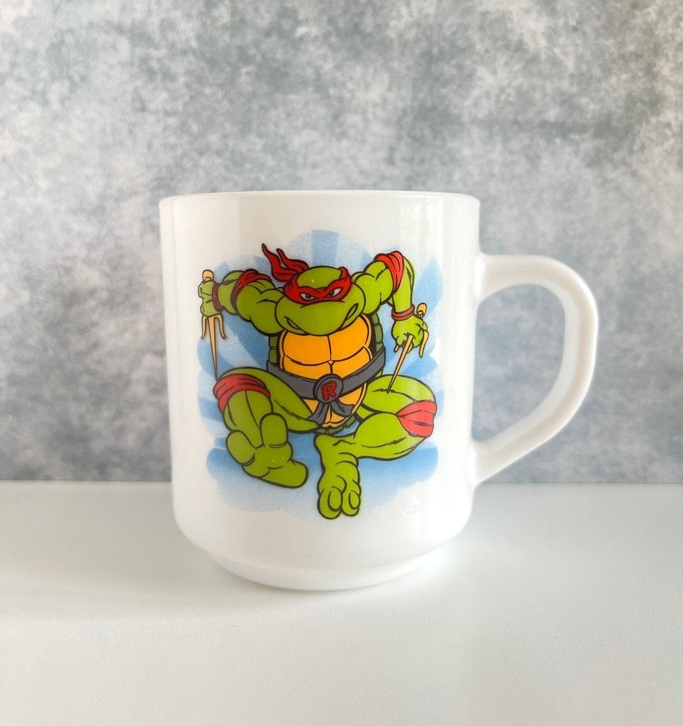 Tasse Raphaël Tortues Ninja - Arcopal Raguletto 1991, Huis en Inrichting, Keuken | Servies, Gebruikt, Mok, Vintage, Overige materialen