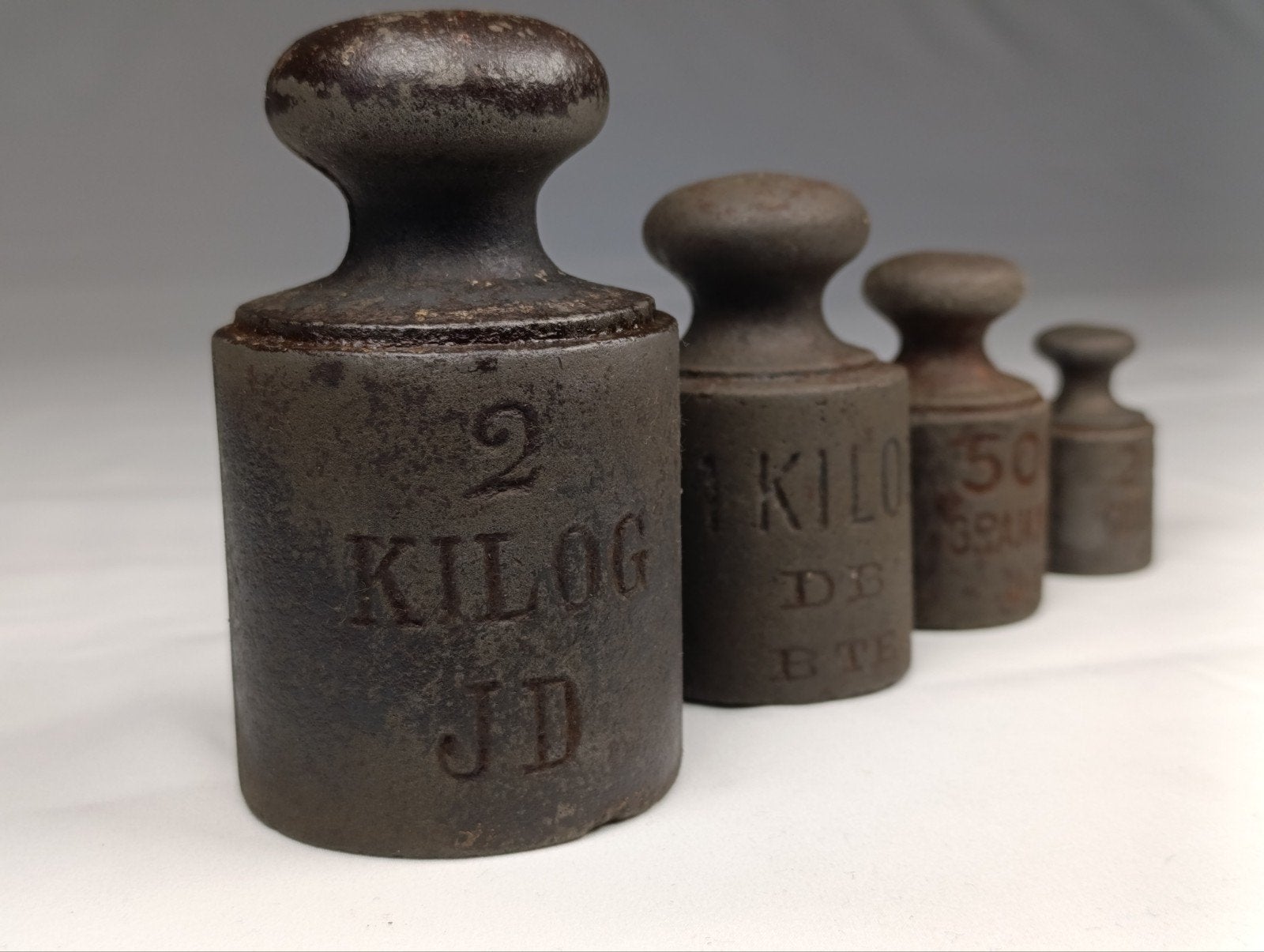 Set van 4 antieke gietijzeren knopgewichten, Antiek en Kunst, Ophalen of Verzenden
