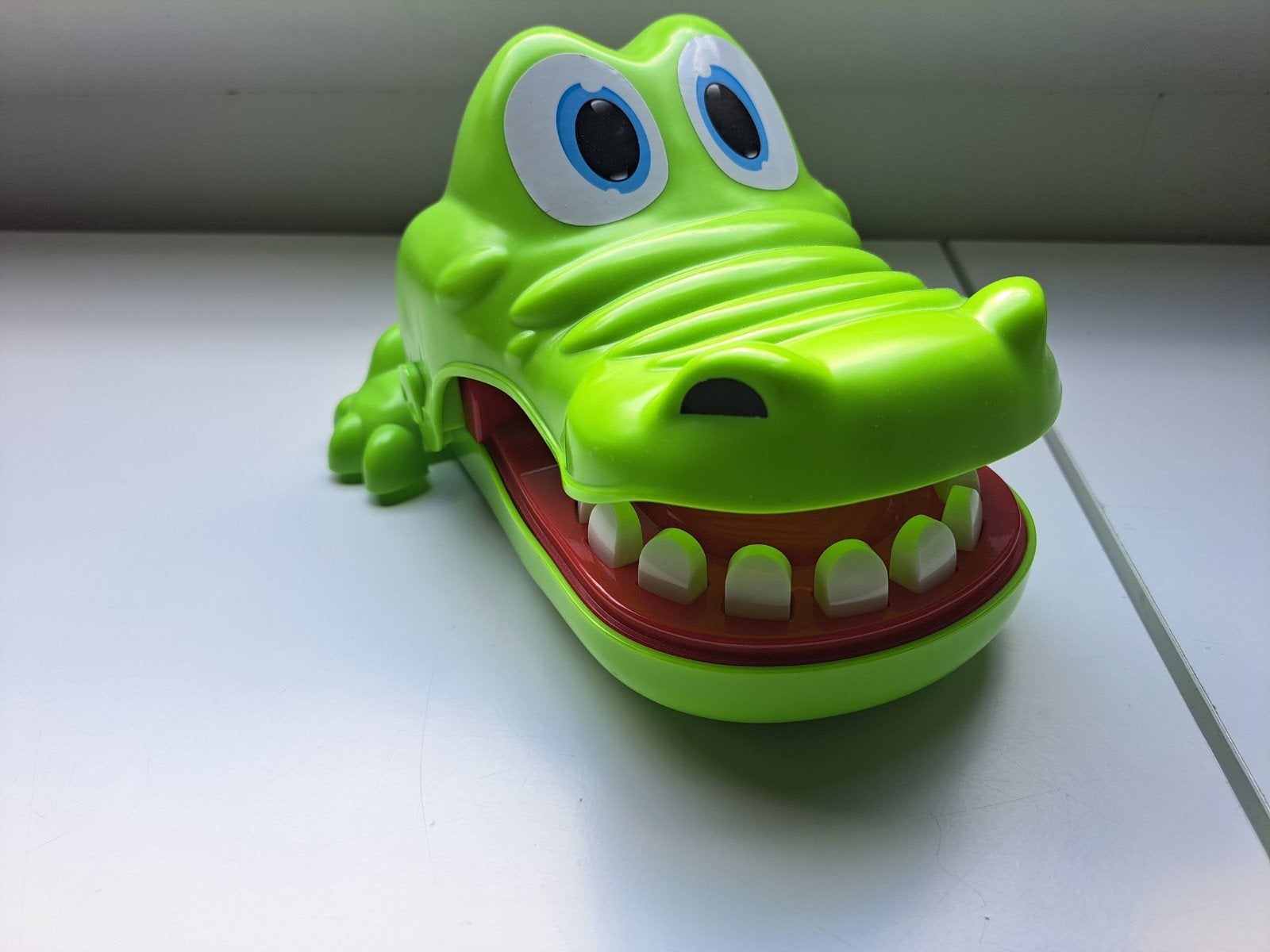 spel krokodil met kiespijn, Ophalen