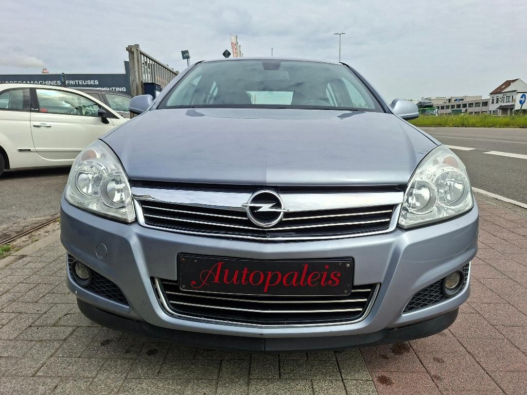 Opel Astra Astra 1.4i Enjoy, Auto's, Opel, Zwart, 4 cilinders, Leder en Stof, 146 g/km