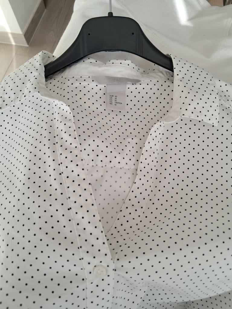 Witte bloes met zwarte stippen, Ophalen