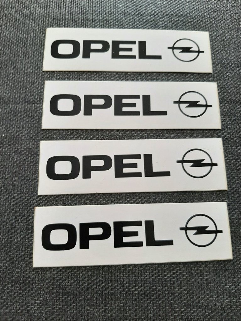 4 Opel stickers wit zwart 10 cm op 3 cm, Ophalen, Zo goed als nieuw