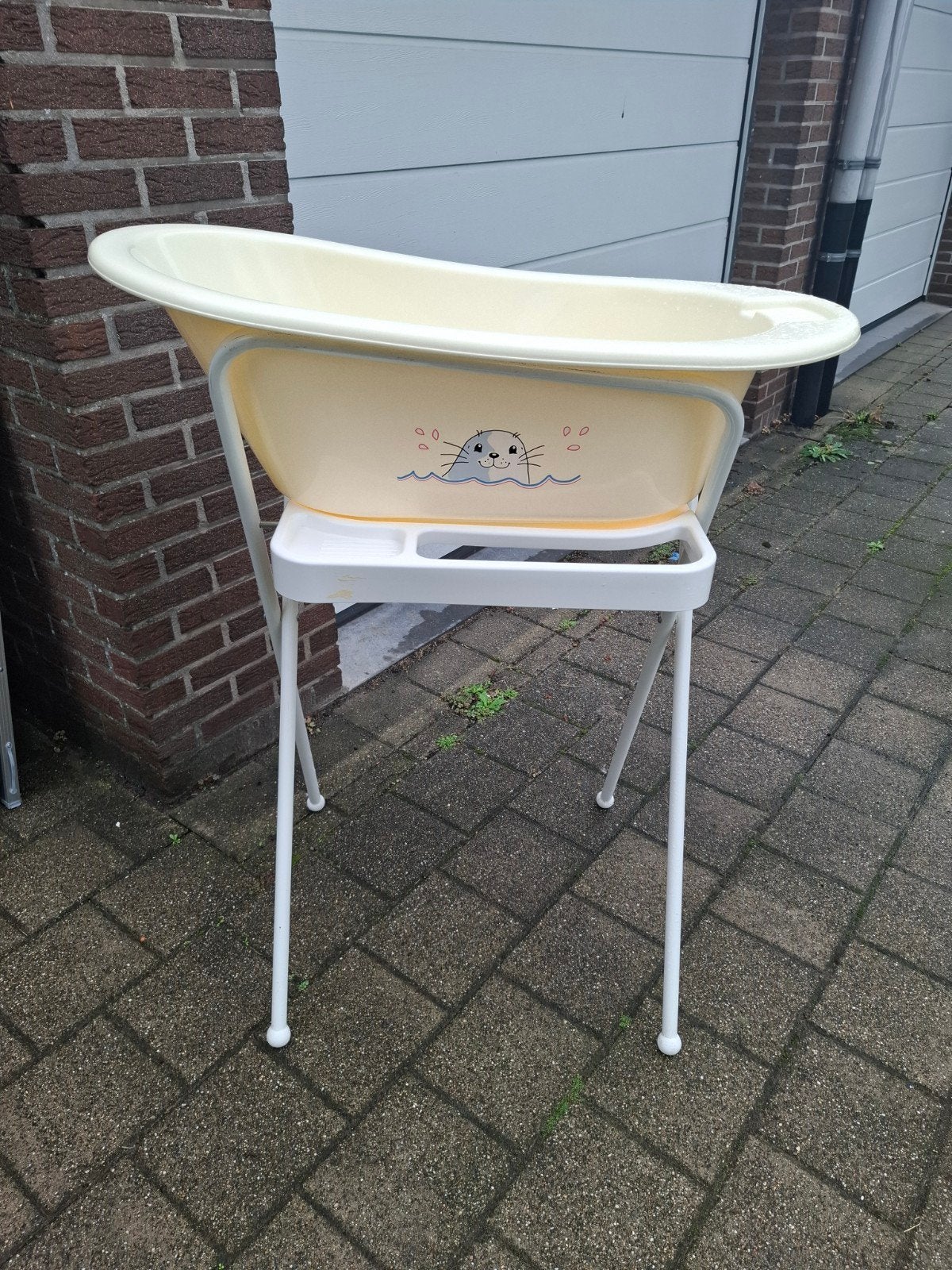 babybad op staander, Ophalen