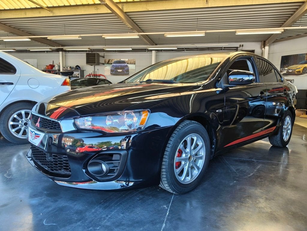 LANCER 1.6i SEDAN *SPOILER*SCHERM*CLIM*, Auto's, Voorwielaandrijving, 4 deurs, Stof, 4 cilinders