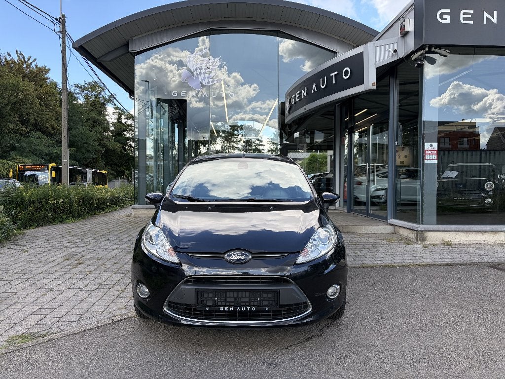 Ford Fiesta 1.6 TDCi Titanium ECOnetic * 12 MAANDEN GARANTIE, Auto's, Voorwielaandrijving, Stof, Zwart, 4 cilinders