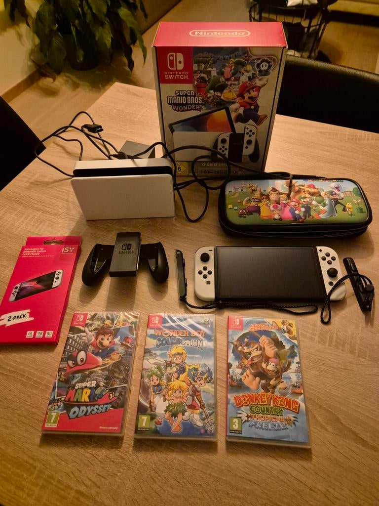 Nintendo Switch oled met games in nieuwstaat!, Games en Spelcomputers, Spelcomputers | Nintendo Switch, Zo goed als nieuw, Switch OLED