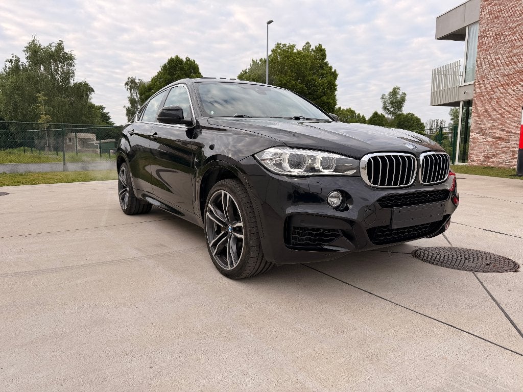 BMW X6 xDrive50i M Pack – 2015, Auto's, BMW, Automaat, 330 kW, Sportstoelen, Zwart