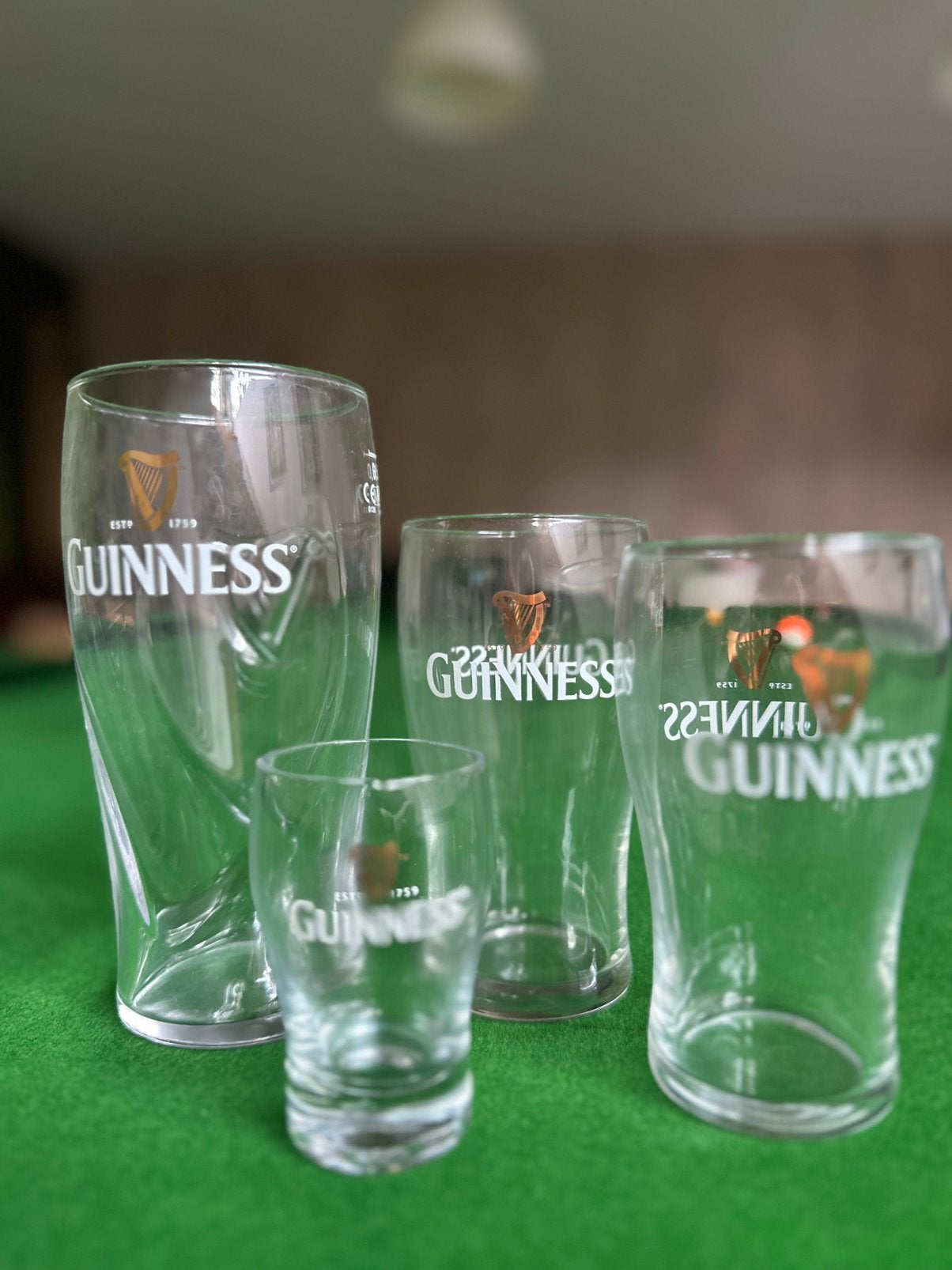 4 Guinness glazen - diverse afmetingen, Ophalen of Verzenden, Zo goed als nieuw, Bierglas