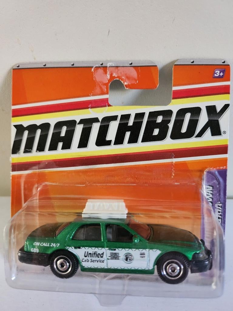 Matchbox Taxi '06 Ford Crown Victoria (2010), Hobby en Vrije tijd, Ophalen of Verzenden, Nieuw