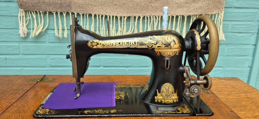 Antiek Singer naaimachine, Ophalen