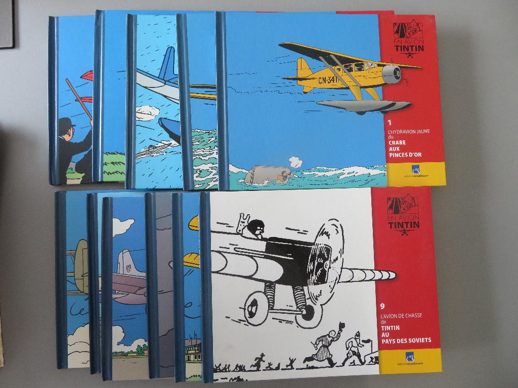 11 hardcover En Avion Tintin + reclame brochure, Verzamelen, Verzenden, Kuifje, Zo goed als nieuw, Boek of Spel