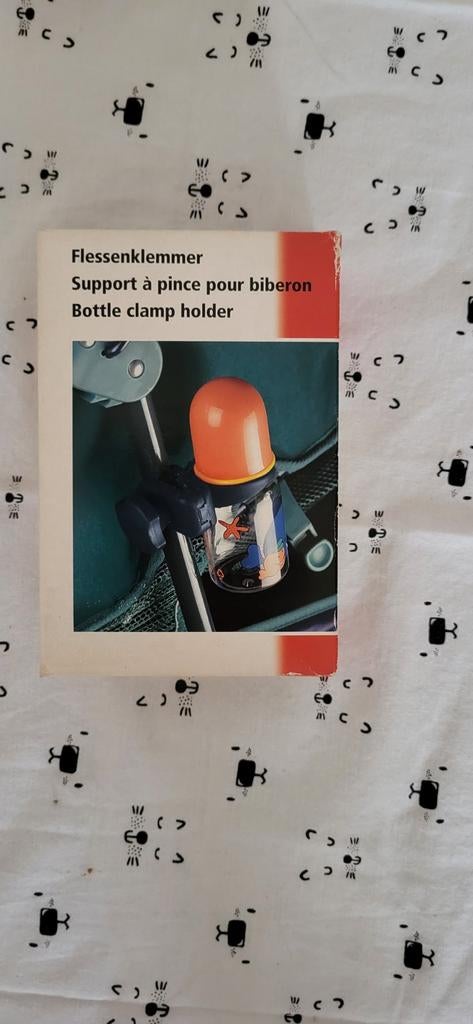 Flessenklemmer voor aan buggy, Enlèvement
