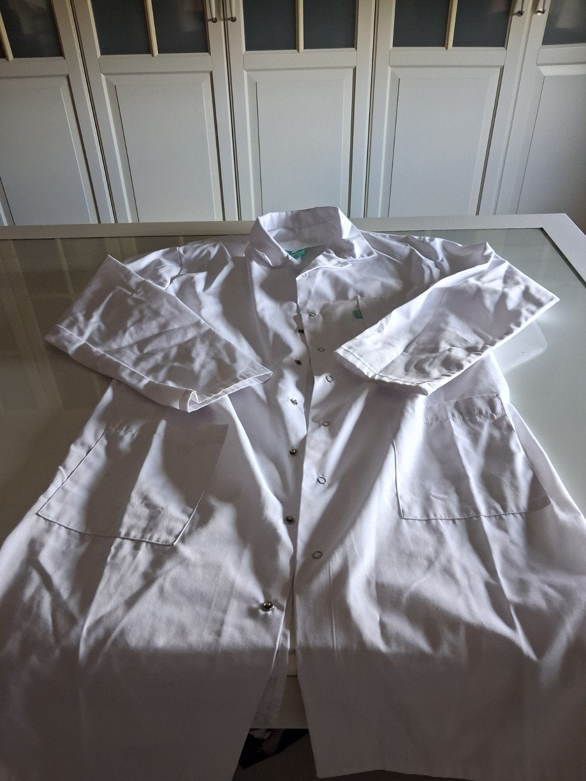 Labo jas , witte labo jas, Ophalen
