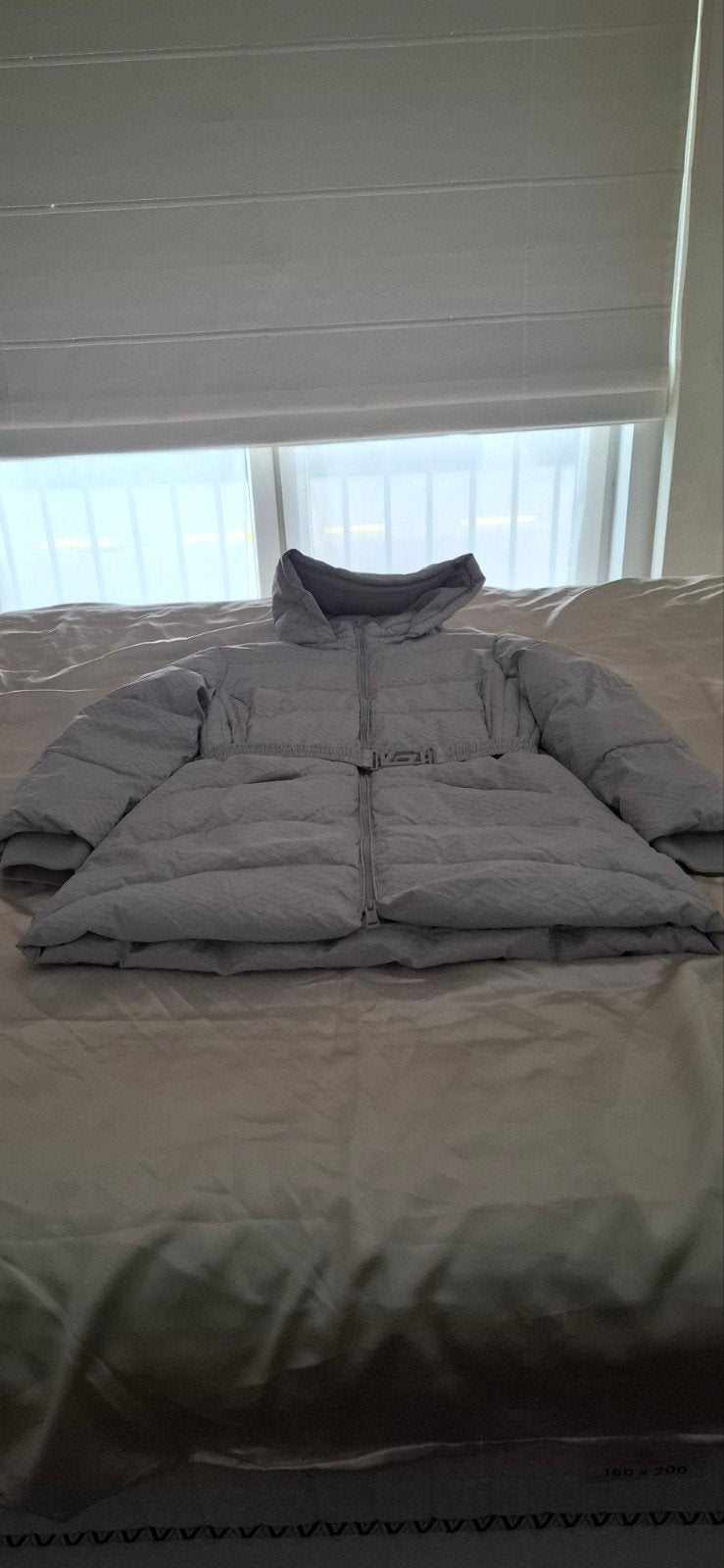 Winterjas Guess, Ophalen