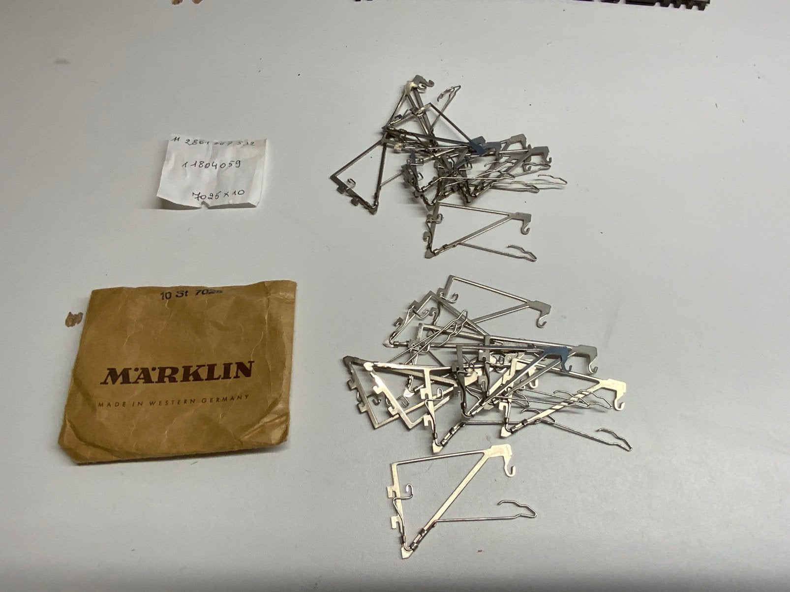 SET VAN 20 MARKLIN 7025 BOVENLEIDINGDRAAGARMEN, Ophalen of Verzenden, Zo goed als nieuw, Märklin