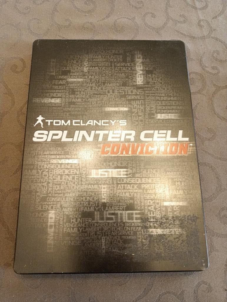 Splinter cell conviction. Boitier métallique et bande son, Ophalen