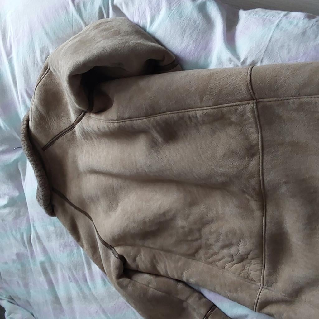 Mantel mouton retourne, Ophalen, Zo goed als nieuw