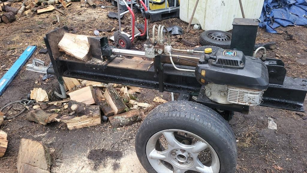 Houtkliever op remorque te huur., Ophalen