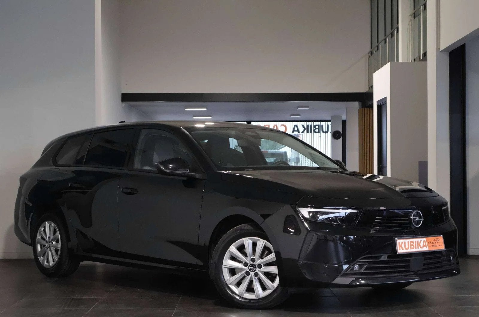Opel Astra Astra Sports Tourer 1.2 Turbo LijnA Camera Garaan, Auto's, Stof, Gebruikt, 1199 cc, Zwart