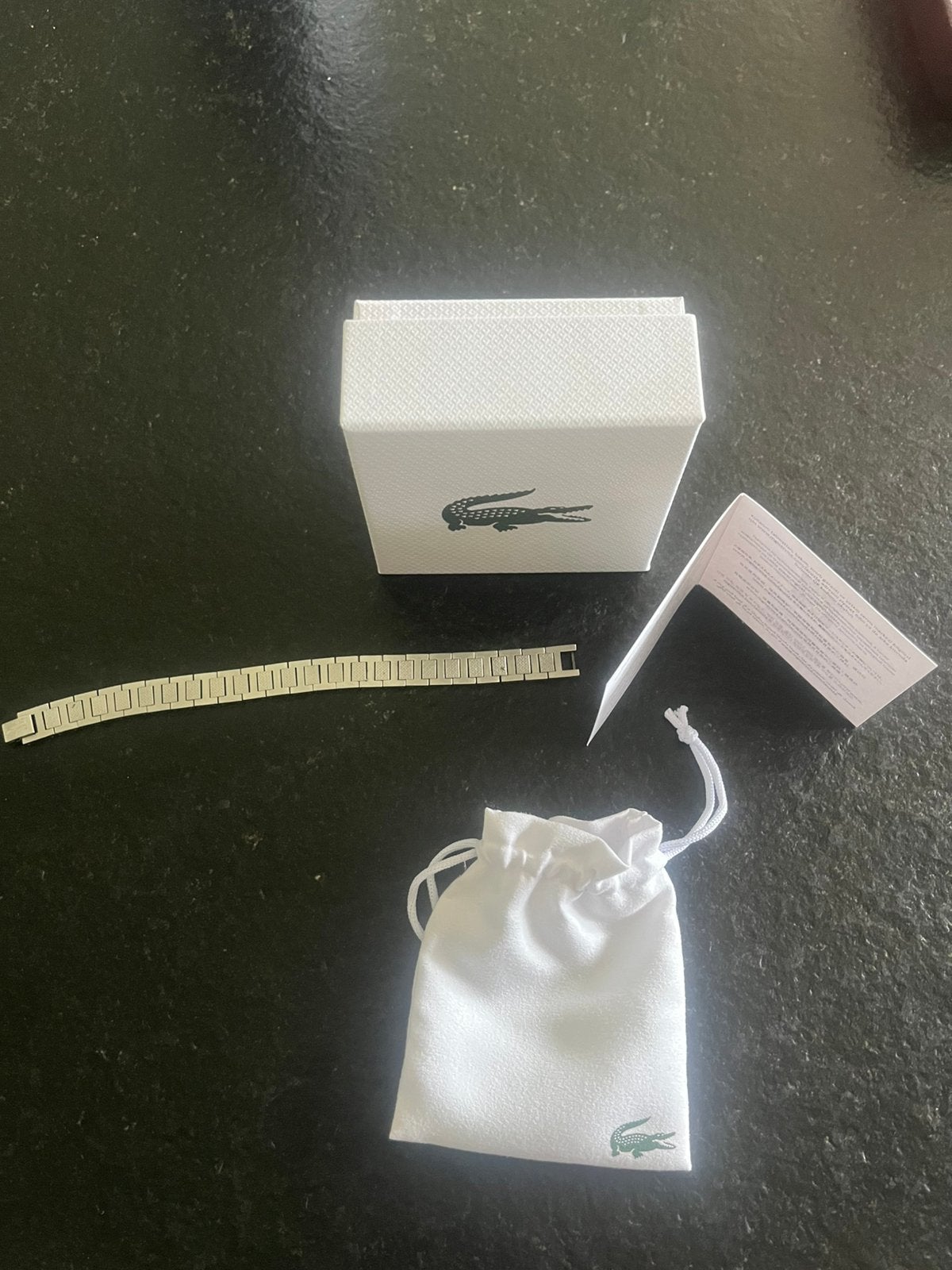 Lacoste bandje in het zilver, Gebruikt, Staal, Ophalen of Verzenden, Zilver